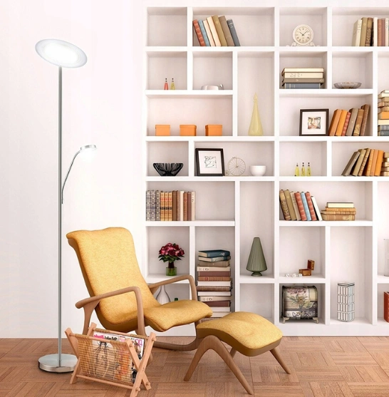 comfortable chair accompanied by a lamp, set against a backdrop of a bookshelf brimming with books