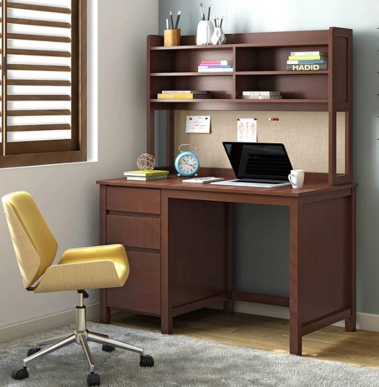 Study desk with a laptop and chair, designed for productivity and comfort in a learning environment.