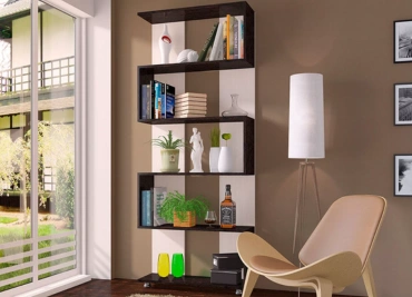 A sleek bookcase featuring multiple shelves alongside a stylish chair, perfect for a modern lifestyle